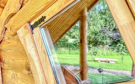The quirky windows of Rose Hollow the romantic log cabin