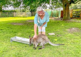 Wendy talking to the wallaby at Acorn glade Glamping  Yorkshire