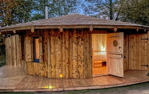 The handcrafted exterior of daisy Roundhouse at Acorn Glade Glamping